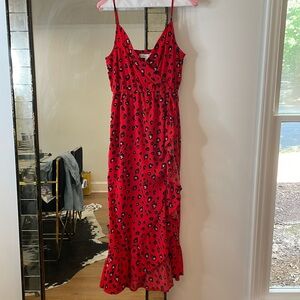 Red animal print midi dress with wrap top and hidden bust snap. Elastic waist!